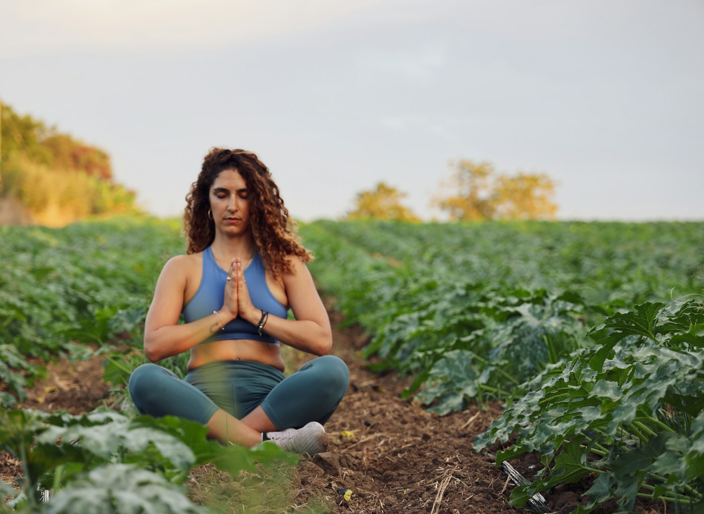 Woman meditating calmly outdoors